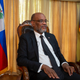 Haiti’s Prime Minister Ariel Henry gives an interview at his private residence in Port-au-Prince, Sept. 28, 2021. Haiti welcomed the new year with violence as the prime minister fled the northern city of Gonaïves on Saturday, Jan. 1, 2022 following a shootout between his security forces and an armed group that had warned the leader not to set foot in the city.